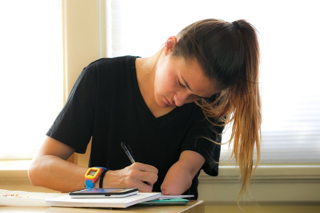 Seattle Reign defender Carson Pickett starts her day with a usual breakfast of a toasted English muffin with peanut butter and honey, and then she does some writing. She does a devotional, keeps to-do lists and writes down restaurant names for when her parents visit, checks her planner for her workouts and keeps a personal journal. “I’m a very big planner,” she said, smiling. She then jumps on her iPad to catch up with social media and post updates, as she is an ambassador for Play Like a Girl, a non-profit organization and campaign to get girls empowered through fitness and sports. (Bettina Hansen/The Seattle Times)