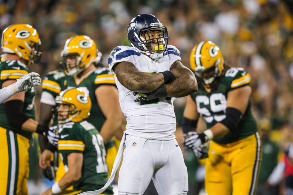 Bruce Irvin celebrates a tackle against the Packers during the Seahawks’ loss at Green Bay on Sept. 20, 2015. (Dean Rutz / The Seattle Times)