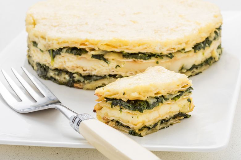 This tender vegetarian kugel is fitting for Seder — or anytime during Passover — and easy to prepare, with layers of creamy cheeses and early season sauted greens.  (For The Washington Post/For The Washington Post)