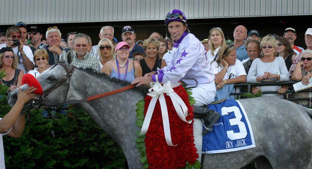 Jockey Russell Baze sits on Sky Jack after winning the Longacres Mile at Emerald Downs on Aug. 24, 2003. (The Seattle Times)