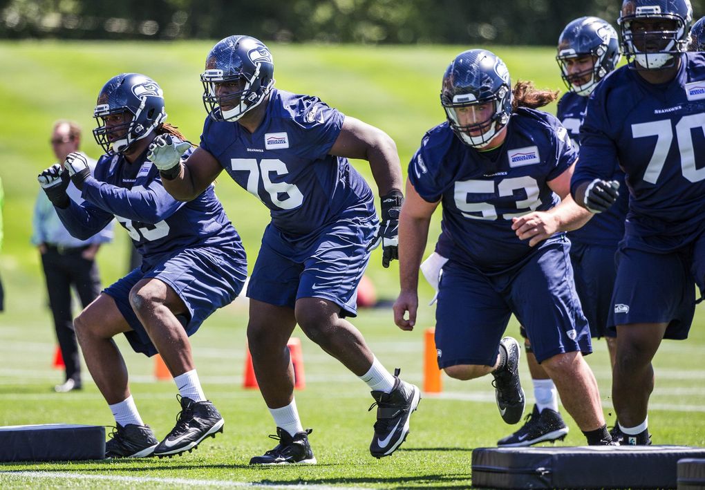 Top draft pick Germain Ifedi (76) gets familiar with the Seahawks line Friday at rookie minicamp. (Dean Rutz / The Seattle Times)