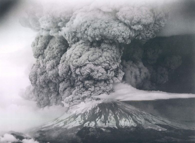 Mount St. Helens erupts in spectacular fashion on May 18, 1980. The northern face of the mountain collapsed, and an ash plume spewed about 15 miles high, darkening skies nearby and in Eastern Washington and beyond. (Seattle Times archive, 1980)