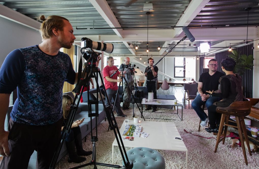 Camera operator Alex Liapunov, left, captures an interview for the show Start Up, with host Gary Bredow and Siren CEO Susie Lee. (Steve Ringman/The Seattle Times)