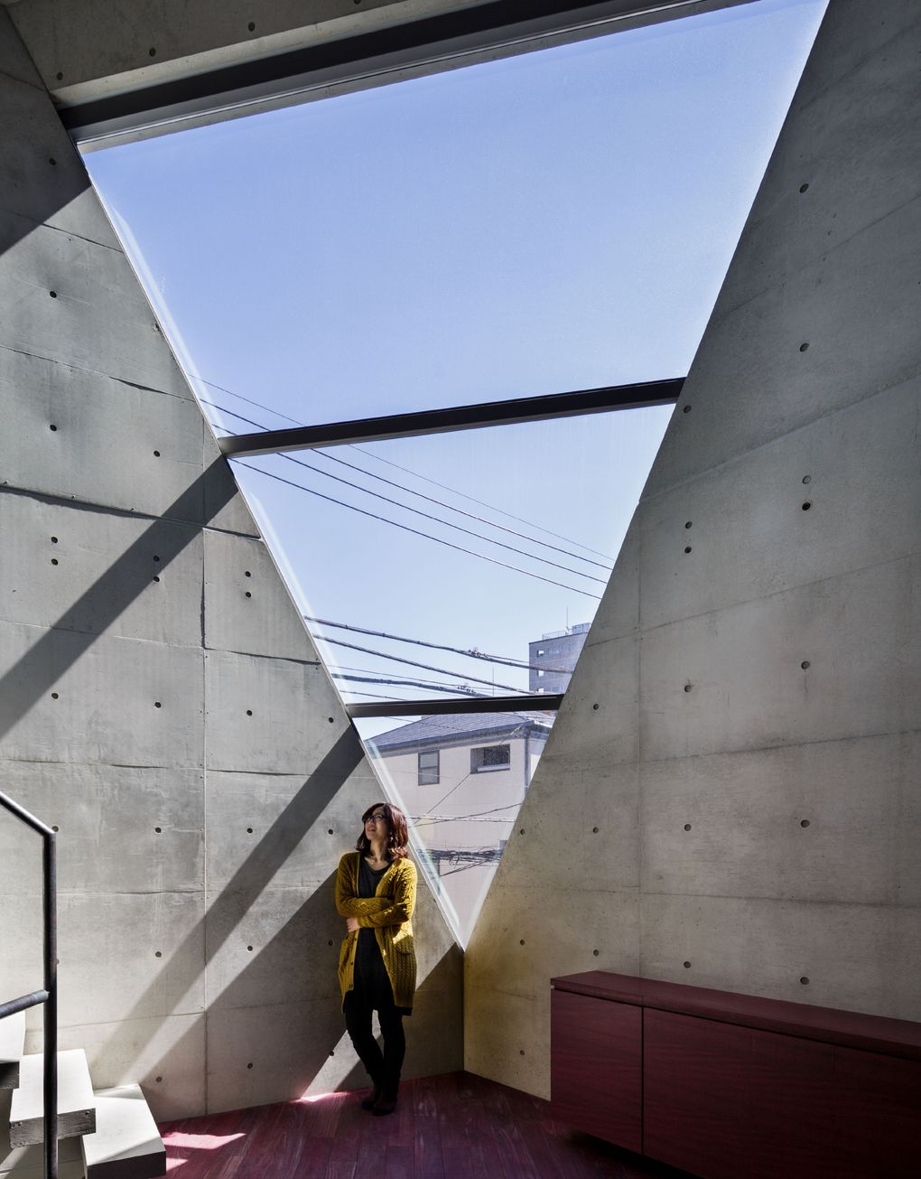 A sense of spaciousness is created by slicing away a corner of the continuous four-story space in R torso C, in Tokyo. (Courtesy of Matthew Williams)