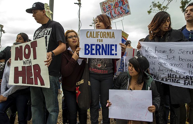 Protesters and supporters of Sen. Bernie Sanders of Vermont demonstrate outside a campaign event for Hillary Clinton at East Los Angeles College, May 5, 2016. Californiaâ€™s June 7 vote is the largest prize in the Democratic presidential primary process. (Monica Almeida/The New York Times)