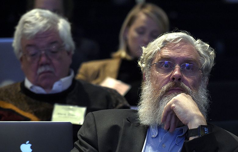 Harvard Medical School’s George Church listens to a panel discussion at the National Academy of Sciences international summit on the safety and ethics of human gene editing, Tuesday, Dec. 1, 2015, in Washington. Alternating the promise of cures for intractable diseases with anxiety about designer babies and eugenics, hundreds of scientists and ethicists from around the world began debating the boundaries of a revolutionary technology to edit the human genetic code.  (AP Photo/Susan Walsh)