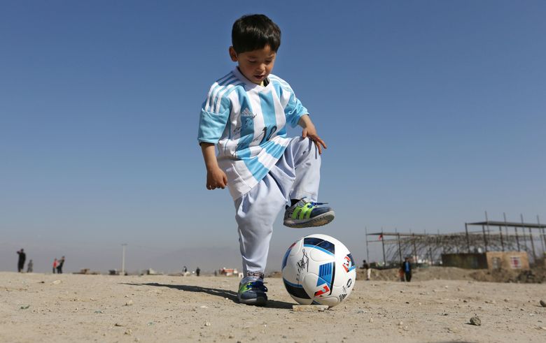 5-year-old Afghan soccer fan with makeshift Lionel Messi jersey