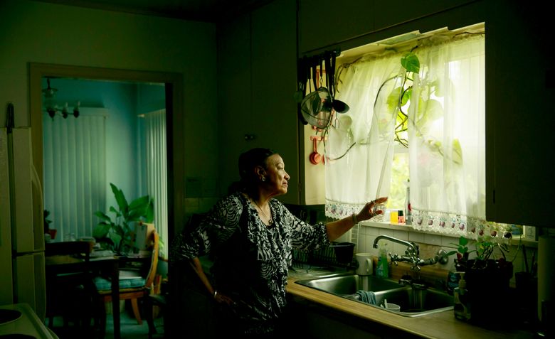 Pastor Patrinell Wright, in her Central District home, remembers when the neighborhood was mostly black and middle class. Today, less than one-fifth of the population is black. “I miss my friends,” she says. (Erika Schultz / The Seattle Times)