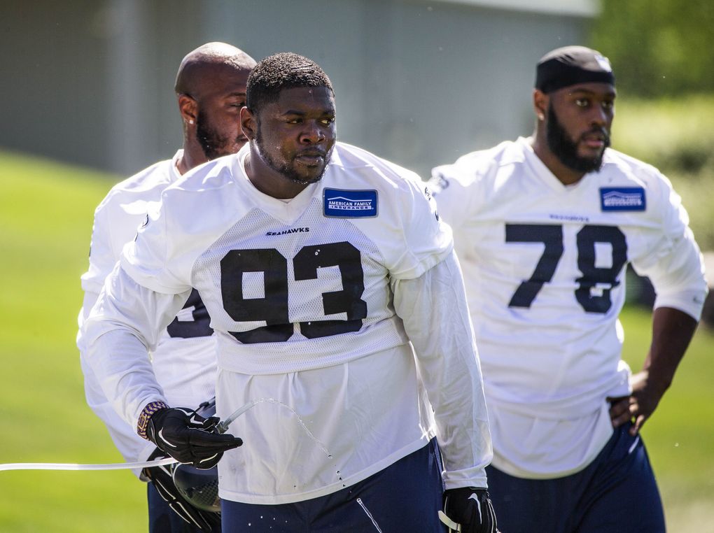 Defensive tackle Jarran Reed (93) breaks for water between drills Friday at Seahawks rookie minicamp. The Seattle Seahawks Rookie Minicamp opened Friday, May 6, 2016 at the VMAC in Renton, WA. (Dean Rutz/The Seattle Times)
