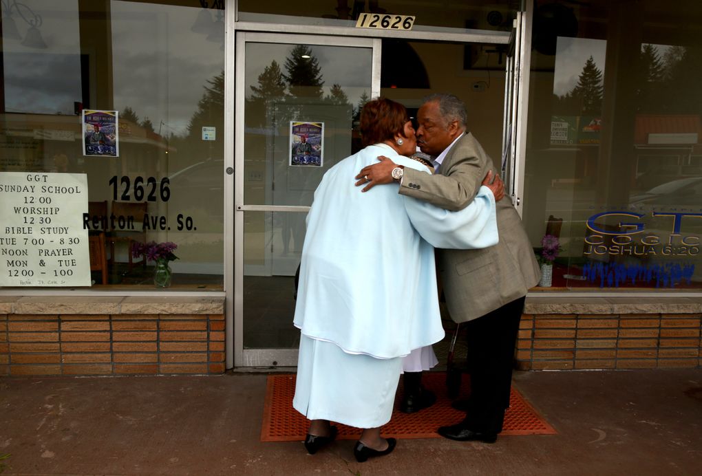 Thomas Vincent greets churchgoers outside Truevine of Holiness Missionary Baptist Church in Skyway. (Erika Schultz/The Seattle Times)