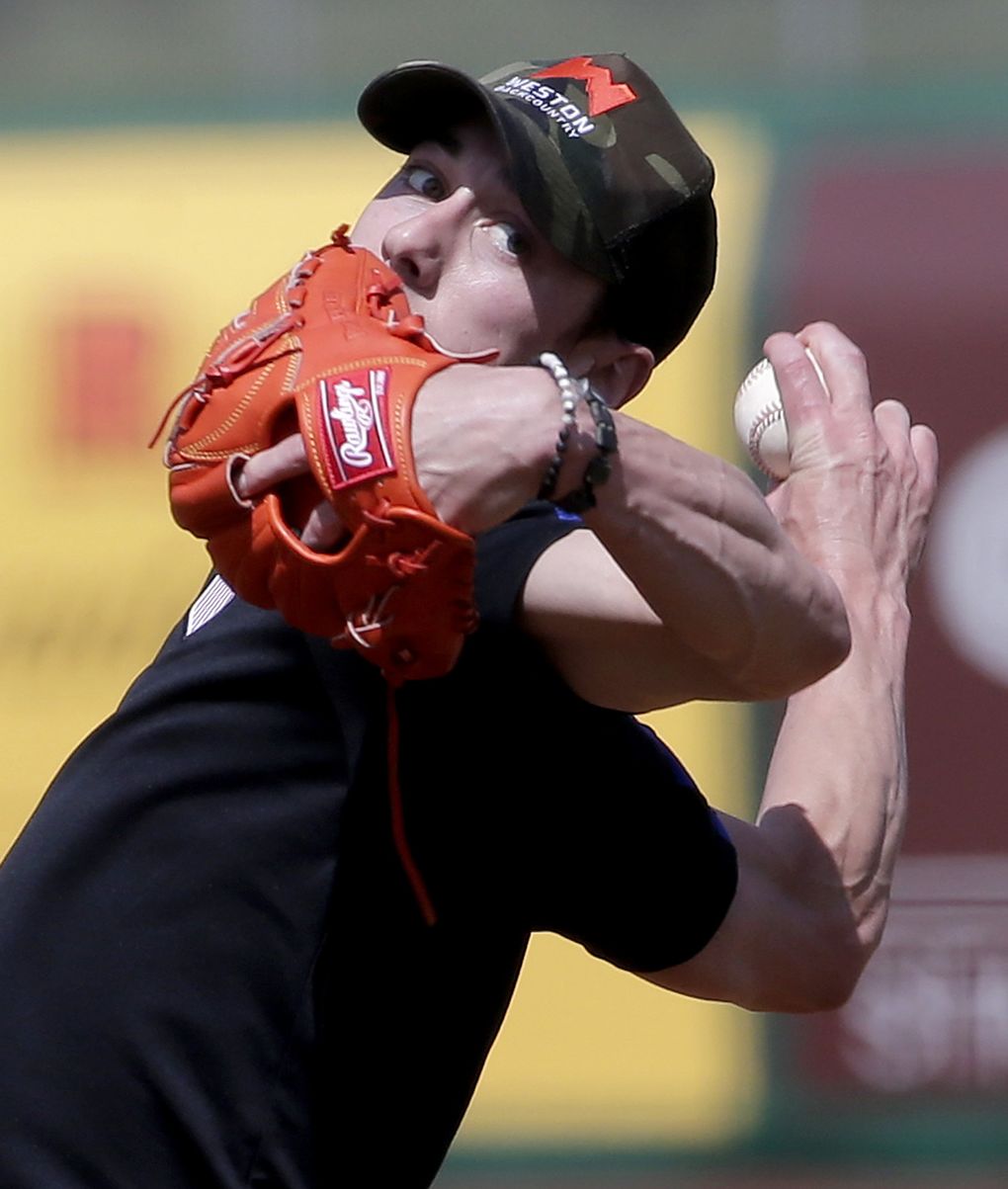 Pitcher Tim Lincecum delivers during a workout for scouts in Scottsdale, Arizona, on March 6. (AP Photo/Matt York) AZMY101