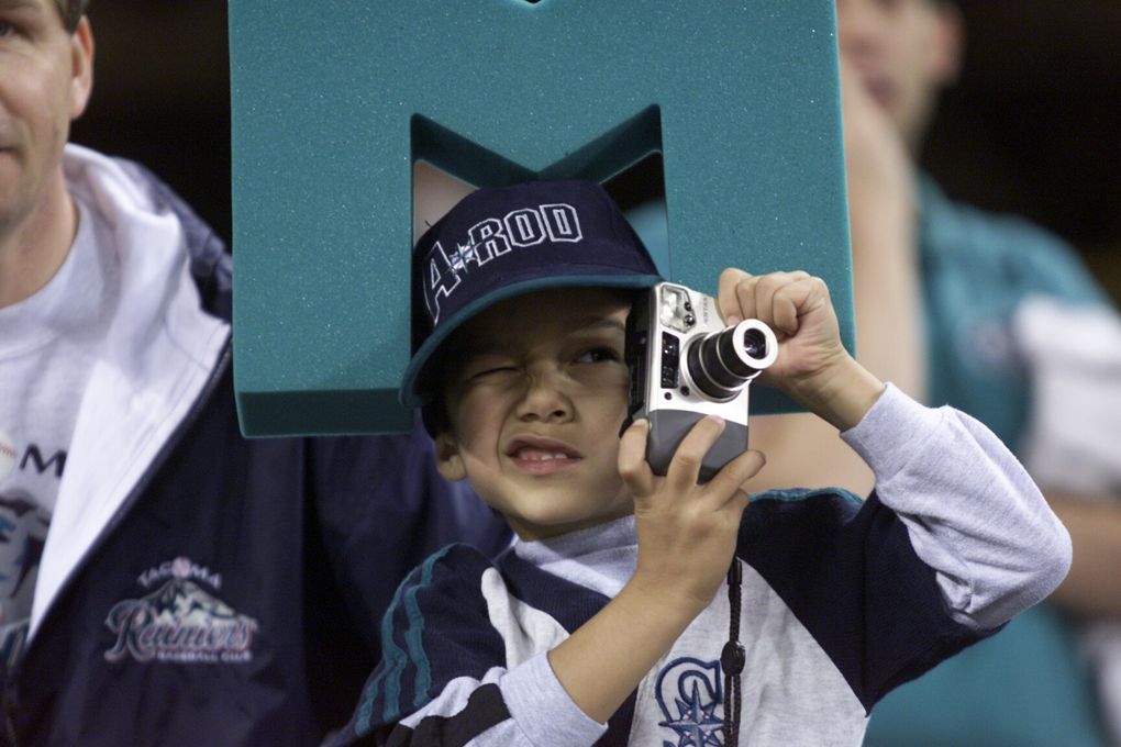 Ryan Ogburn, 6 years of Gig Harbor, takes pictures of the New York Yankees batting practice before Game 3 of the ALCS.
PRE GAME IMAGES
Seattle Mariners and New York Yankees at Safeco Field for ALCS Game 3