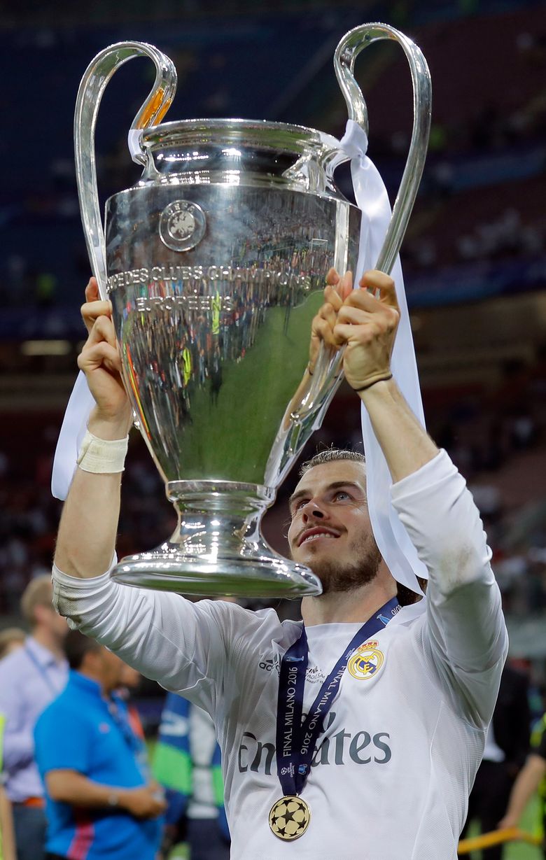 Real Madrid's Gareth Bale celebrates with the UEFA Champions