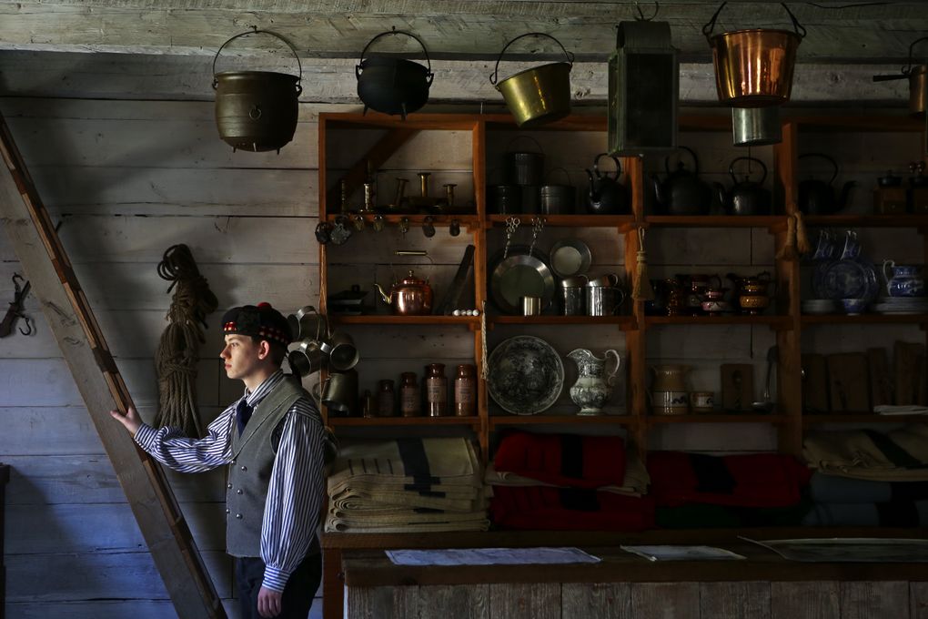 Historical interpreter Josiah Pollock plays the part of a clerk in the Sales Shop, circa 1855, at Fort Nisqually Living History Museum. He can answer questions about settlers, native peoples and Hudson’s Bay Co. trading-post personnel who were in the area when it was Washington Territory. (Ken Lambert/The Seattle Times)