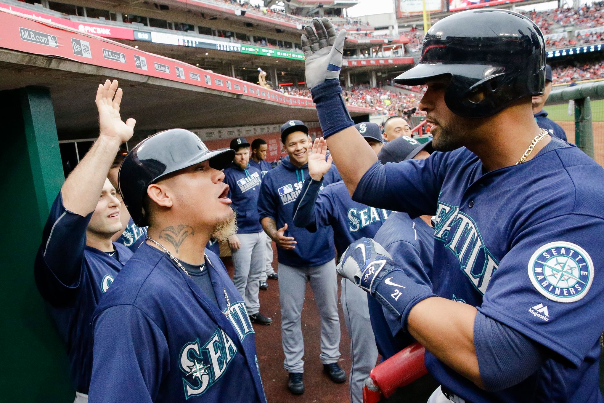 Seattle Mariners' Leonys Martin hits a solo home run off Cincinnati Reds  starting pitcher John Lamb in the second inning of a baseball game,  Saturday, May 21, 2016, in Cincinnati. The Mariners