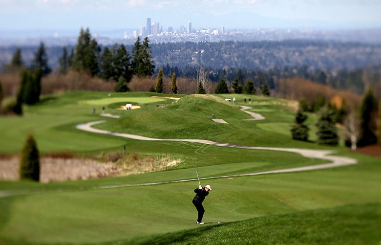 DREAMHOLES 04072011
A golfer swings at the first hole at The Golf Club at Newcastle Coal Creek course Thursday, April 7, 2011 in Newcastle, Wash.
Assign No: 110890