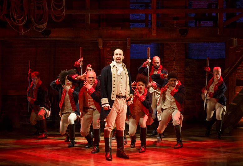 In this image released by The Public Theater, Lin-Manuel Miranda, center, performs in the musical “Hamilton” in New York. David Korins was nominated for a Tony Award for set design for his work on “Hamilton.” The Tony Awards will be held in New York on Sunday, June 12, 2016. (AP Photo/The Public Theater, Joan Marcus)