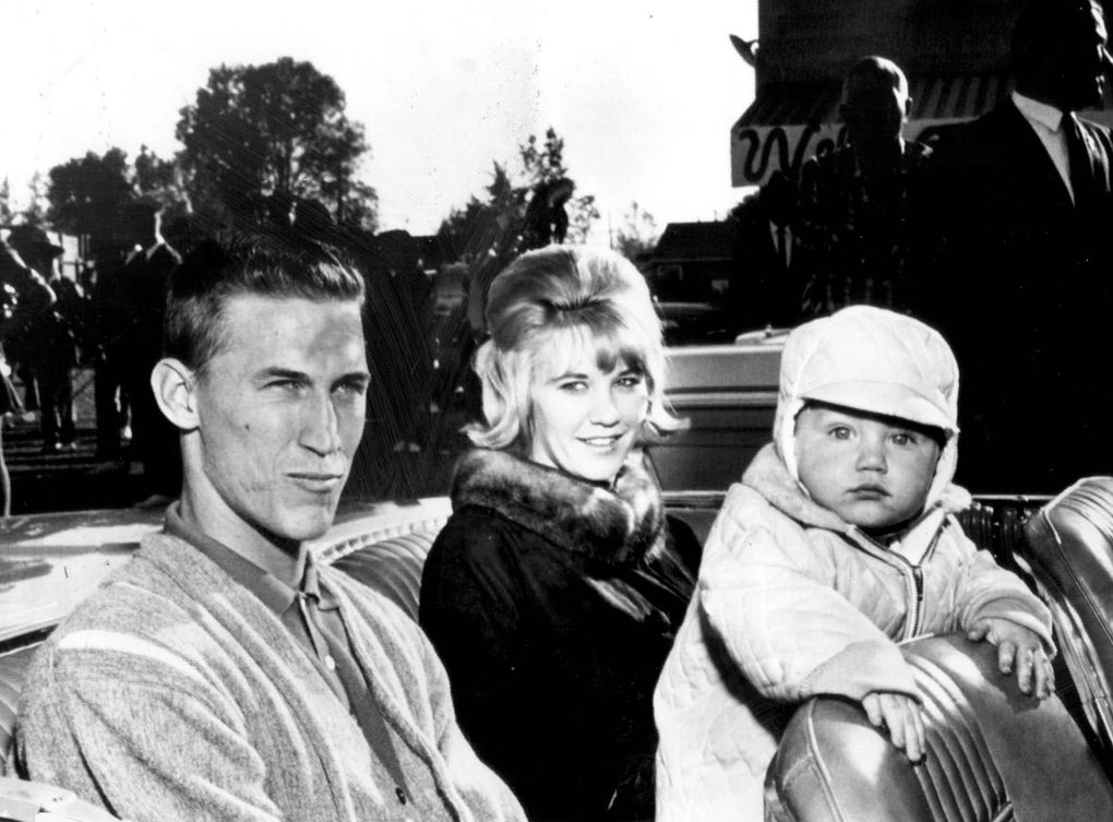 Ten-month-old Mel Stottlemyre Jr. stares at the camera while father Mel. Sr. and mother Jean wait for a parade to start in their hometown of Mabton, Wash., in 1964. (Seattle Times archive)