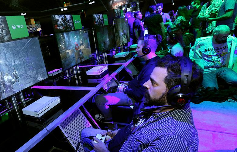 IMAGE DISTRIBUTED FOR MICROSOFT – Fans get hands on with “Gears of War 4”  at the Xbox Media Showcase at E3 2016 in Los Angeles on Monday, June 13, 2016. (Photo by Casey Rodgers/Invision for Microsoft/AP Images)