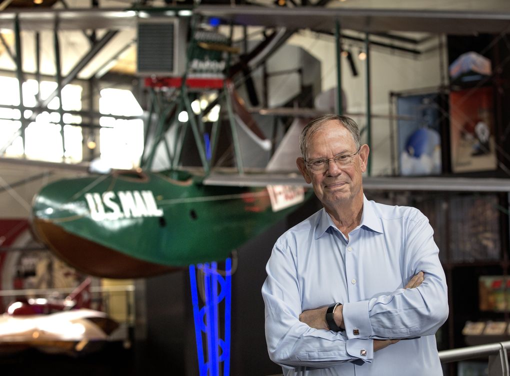 Phil Condit, 75, former chairman and CEO of Boeing, poses at the Museum of History and Industry in front of a Boeing B-1 Seaplane built in 1919. (Mike Siegel / The Seattle Times)