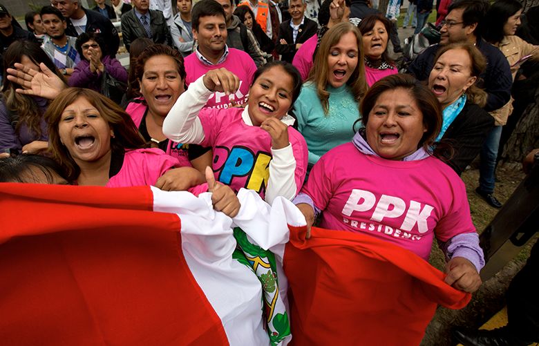 Supporters of presidential candidate Pedro Pablo Kuczynski celebrate outside his campaign headquarters in Lima, Peru, Thursday, June 9, 2016. With 99.5 percent of the polling stations counted, front-runner Kuczynski was ahead of rival Keiko Fujimori, the daughter of imprisoned ex-President Alberto Fujimori. (AP Photo/Silvia Izquierdo)