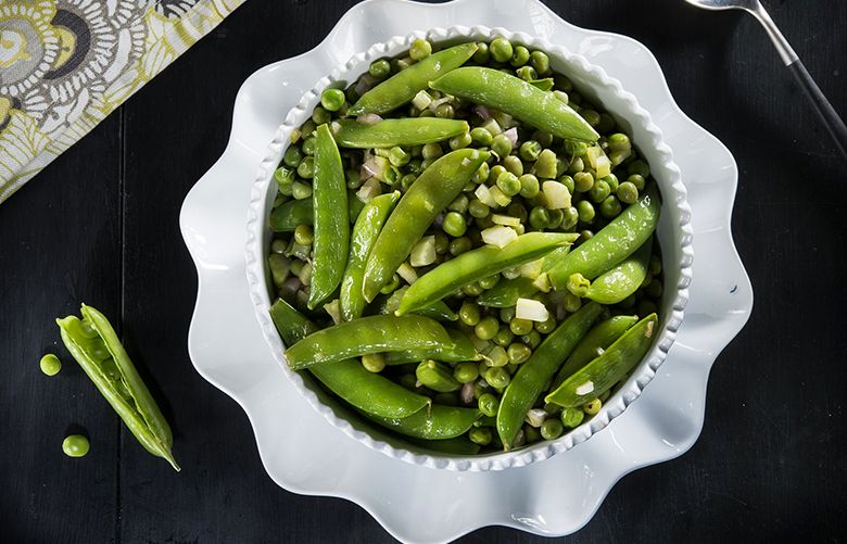 Peas With Sesame Vinaigrette combines two types â€” shelled, fresh-then-frozen garden-variety peas and sugar snap peas â€” into a cold salad with an Asian-inspired vinaigrette. (Tammy Ljungblad/Kansas City Star/TNS)