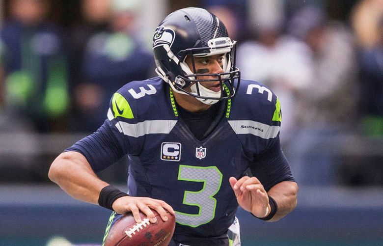 Russell Wilson looks for a receiver along the sideline in the first half. Wilson was 21 of 30 for 249 yards and 3 touchdowns in a 30-13 win over the Browns. The Cleveland Browns played the Seattle Seahawks Sunday, December 20, 2015, at CenturyLink Field in Seattle.