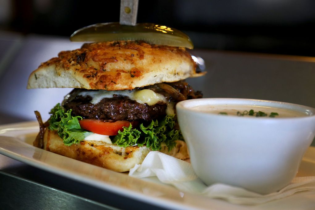 More bison in Ellensburg: A bison burger served on ciabatta bread is a mouth-stretching treat at the Yellow Church Cafe, previously home to a Lutheran congregation. (Johnny Andrews/The Seattle Times)
