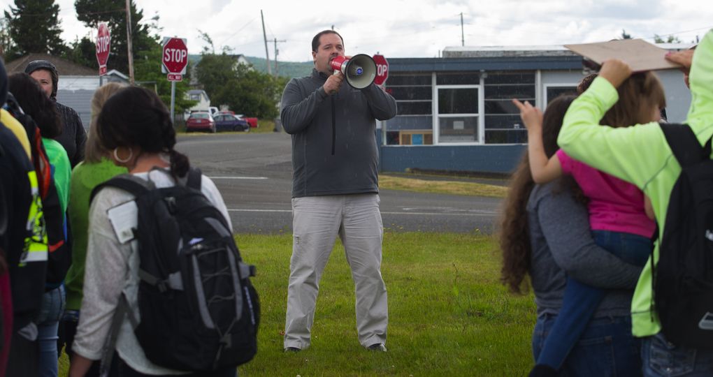 Harbor High School Principal Derek Cook runs an earthquake drill in Aberdeen. The alternative school’s 60-year-old building, which also houses a day care and the Hopkins preschool, has a 99.8 percent chance of major damage in a powerful quake. (Ellen M. Banner/The Seattle Times)