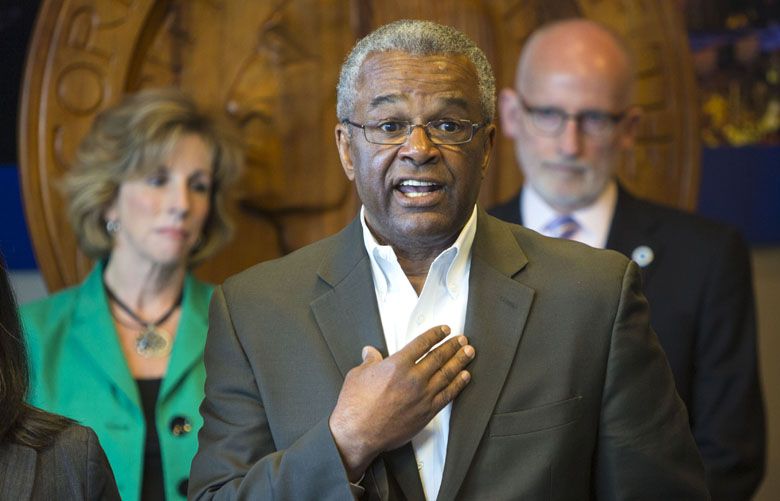 POLICE CHIEF SEARCH  05022014
Police Chief search committee co-Chairman  Ron Sims, center, and committee members Sue Rahr, Executive Director of the Washington State Criminal Justice Training Commission, left, and Tim Burgess, President, Seattle City Council, announce the three finalists for police chief.
 during a press conference at City Hall on Friday afternoon.
138409