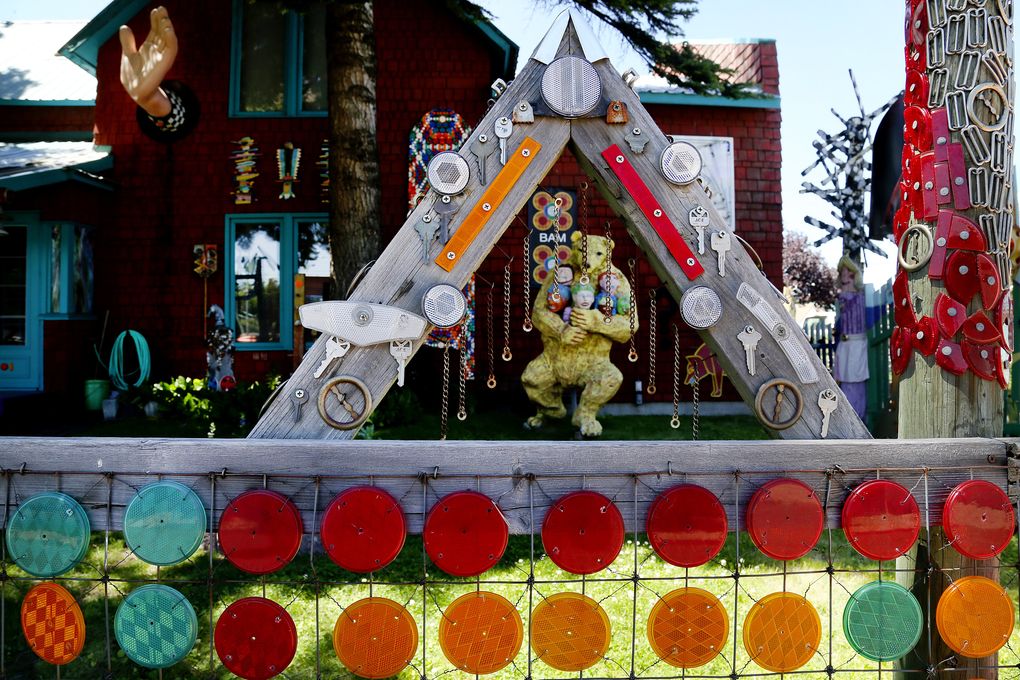 Starting nearly 40 years ago, resident artists Dick Elliott and Jane Orleman turned their home into a quirky Ellensburg work of art known as Dick and Jane’s Spot, incorporating thousands of bottle caps, reflectors and other whimsical add-ons to the house and the fences around it. (Johnny Andrews/The Seattle Times)