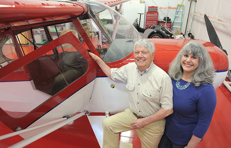 Charles White, founder of Micro AeroDynamics and Anni Brogan, President of the company, show off a plane at the company’s Anacortes hangar equipped with their vortex generators. Scott Terrell / Skagit Valley Herald