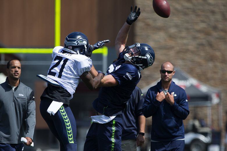 Seahawks defensive coodinator Kris Richard makes a tough phone