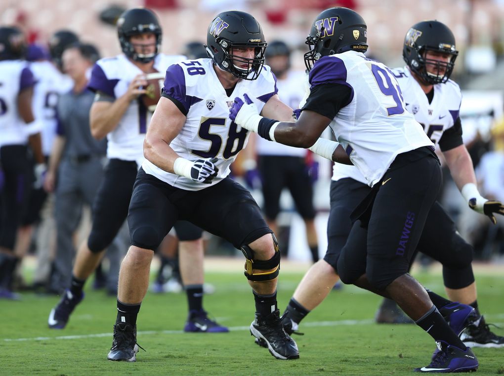 Washington offensive lineman Kaleb McGary, left, practices with Washington defensive lineman Jaylen Johnson before the Washington vs. Southern California game in Los Angeles at Memorial Coliseum on Thursday, Oct. 8, 2015. Washington beat Southern California 17-12, beating former coach Steve Sarkisian in their first meeting since his abrupt departure for the head coaching job at USC in late 2013. (Lindsey Wasson / The Seattle Times)