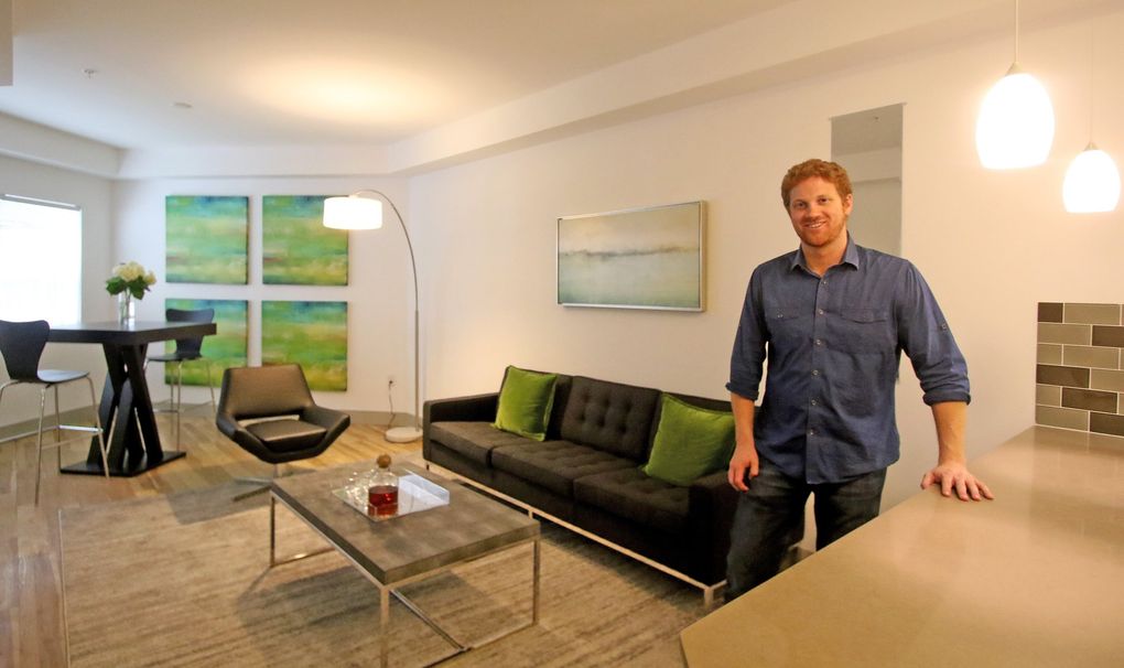 Matt Calkins in his redesigned apartment by Seahawks rookie Zac Brooks. (Greg Gilbert / The Seattle Times)