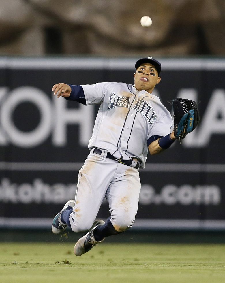 Los Angeles Angels' Kole Calhoun advances to third base on a hit