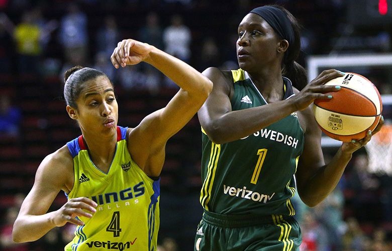 Seattle’s Crystal Langhorne (1) keeps the ball from Dallas’ Skylar Diggins (4) during the WNBA match between the Seattle Storm and the Dallas Wings at KeyArena, Wednesday, August 31, 2016. Storm leads the half, 41-30.