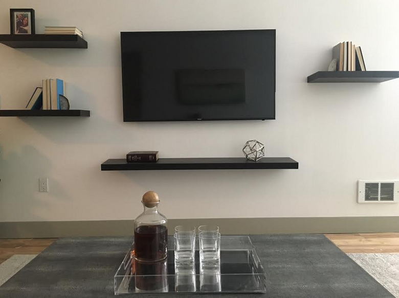 A look at Matt Calkins’ TV and shelving at his new apartment. (Matt Calkins / The Seattle Times)