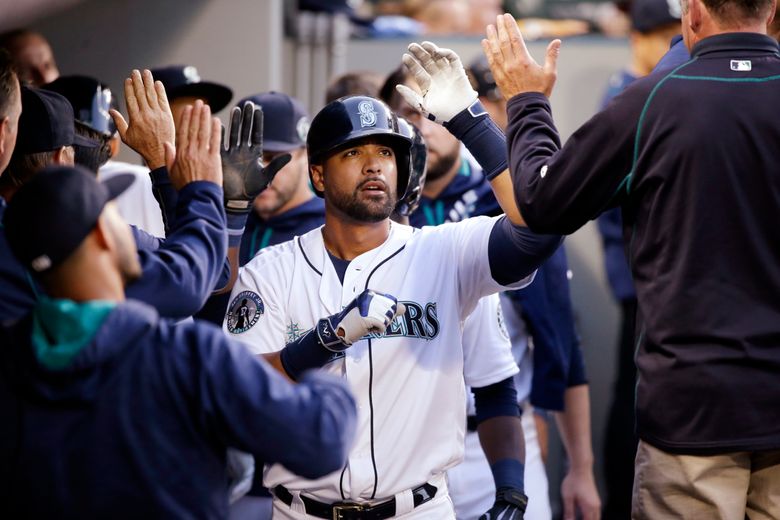 Seattle Mariners Team. Wore their caps backwards in honor of Ken