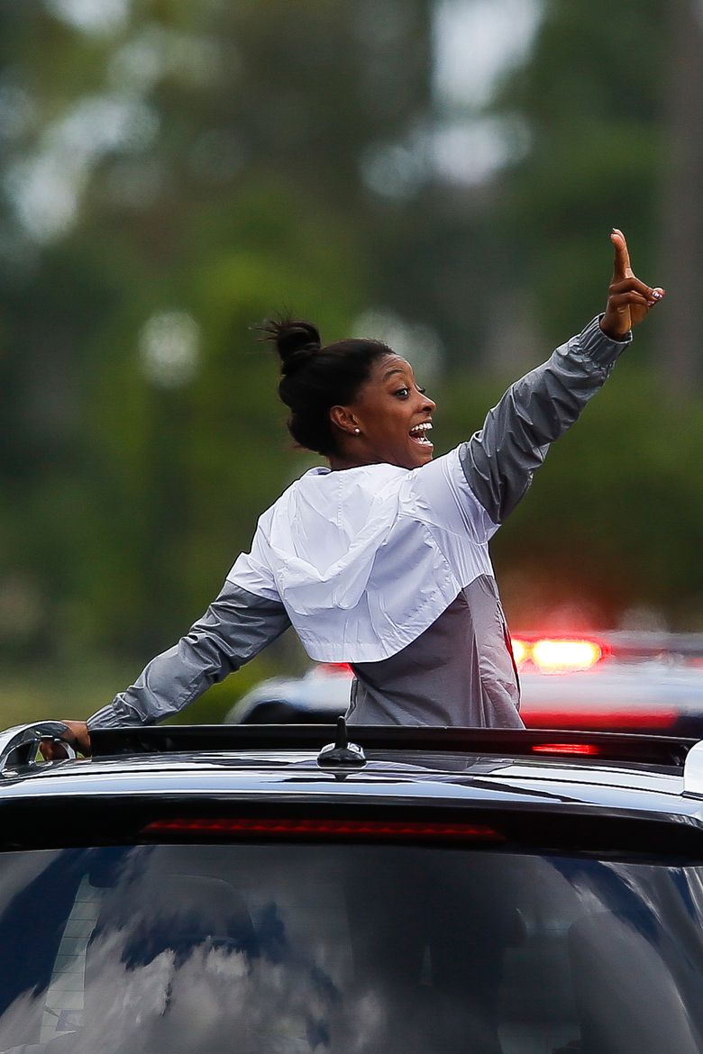 Olympic gold medalist Simone Biles welcomed home to Texas | The Seattle  Times