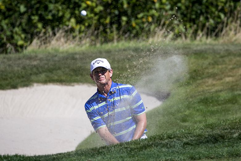 In this 2016 file photo, Lee Janzen chips out of the bunker on the 12th hole during the first round of the Boeing Classic.  (Johnny Andrews/The Seattle Times)