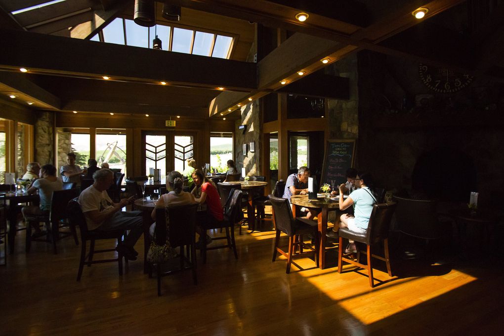 Visitors sip on sparkling wine in the modern, shady tasting room at Treveri Cellars, a welcome stop after a day of Yakima Valley produce shopping. (Sy Bean/The Seattle Times)
