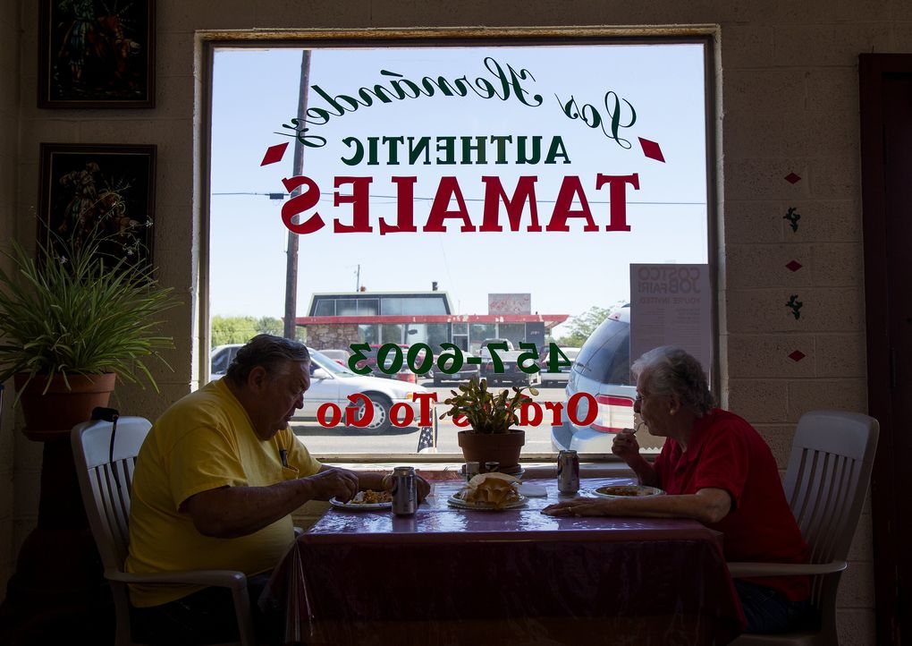 Jackie and Lois Benge enjoy their favorite pork tamales at Los Hernandez, a family-run cafe in Union Gap that has been cooking up corn-husk-wrapped tamales for decades. (Sy Bean/The Seattle Times)