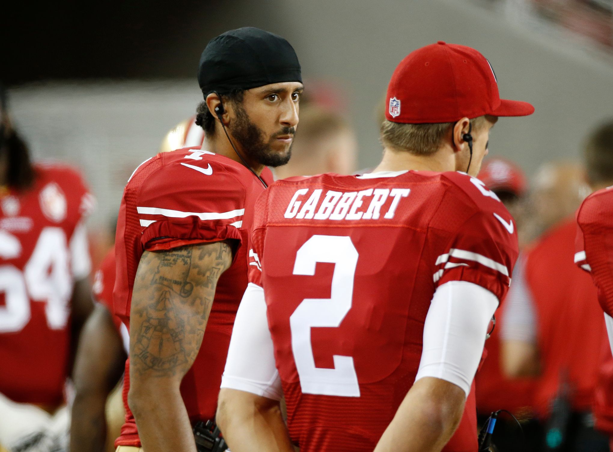 Niners QB Kaepernick refuses to stand for anthem in protest