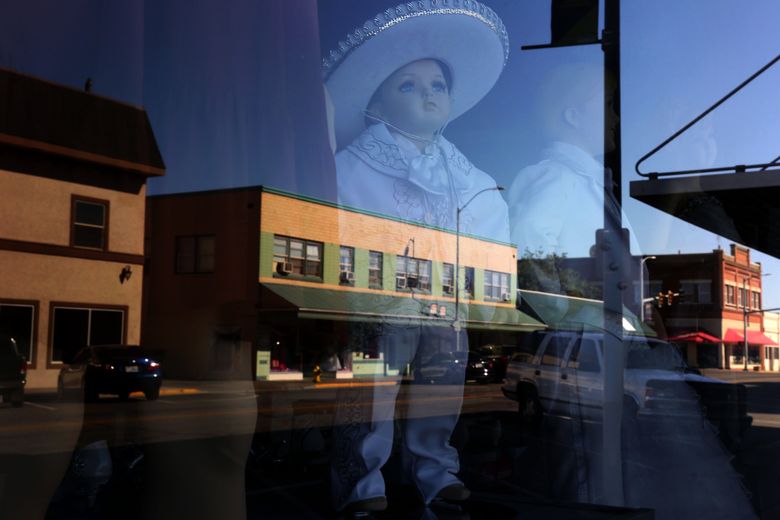 Stores selling clothes for quinceaneras, weddings, baptisms and formal wear line the streets of downtown Pasco. (Erika Schultz/The Seattle Times)