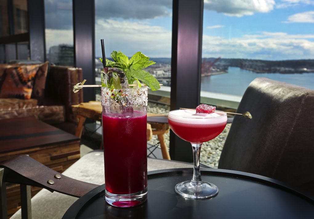 The Nest, on the roof of the Thompson Hotel, has a view that is tough to beat. Enjoy it with one of many cocktails named after birds. Last summer: Caracara, on the left, and the Brazilian Ruby, on the right. (Ken Lambert/The Seattle Times)