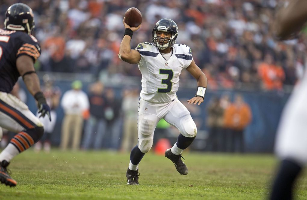 Seahawks quarterback Russell Wilson spots up receiver Sidney Rice crossing near the goal line, and hits him with the game-winning touchdown in overtime to defeat the Chicago Bears, 23-17, on Dec. 2, 2012. (Dean Rutz / The Seattle Times)