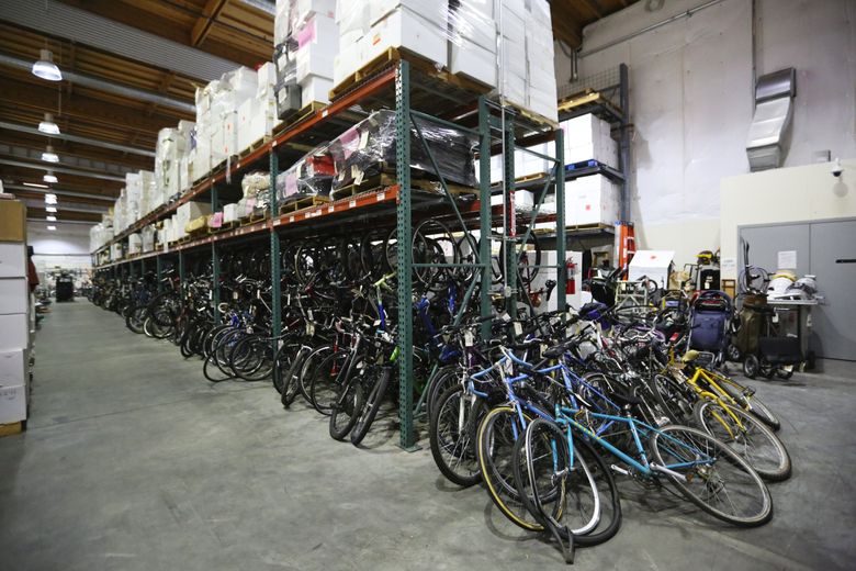 Hundreds of bikes, some of them stolen, are kept at the Seattle Police Department’s evidence and property storage facility. Detective Sgt. Cindy Granard, who runs the operation, says most people don’t photograph their property or record serial numbers, which makes it difficult for police to return the items. (Ken Lambert/The Seattle Times)