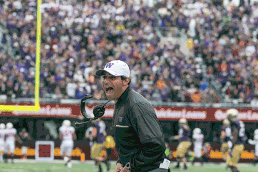 UW wide receivers coach Bush Hamdan celebrates a first-quarter touchdown by wide receiver John Ross in the Huskies’ victory against Rutgers. (Johnny Andrews / The Seattle Times)