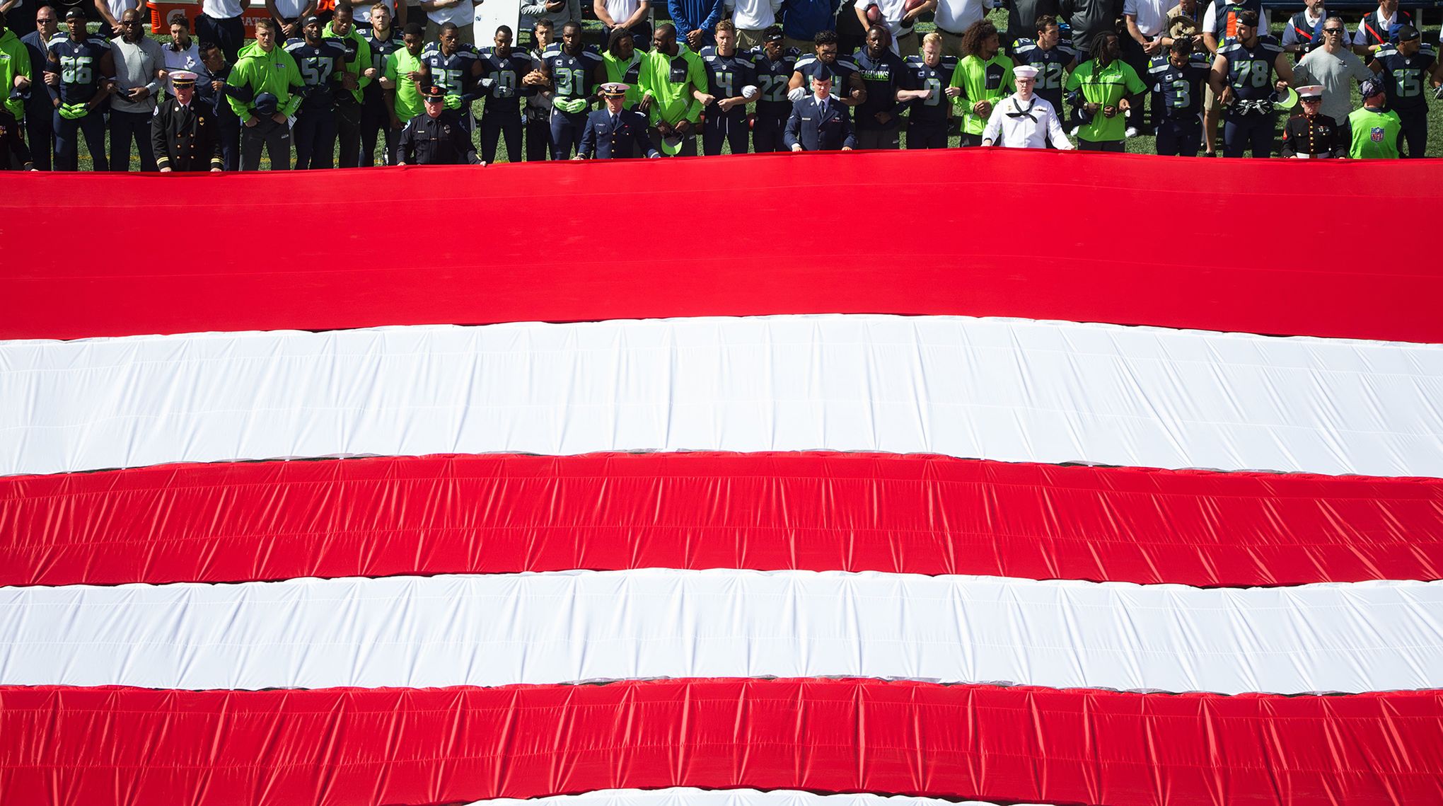 NFL Teams Showcase Moment of Unity During National Anthem – The